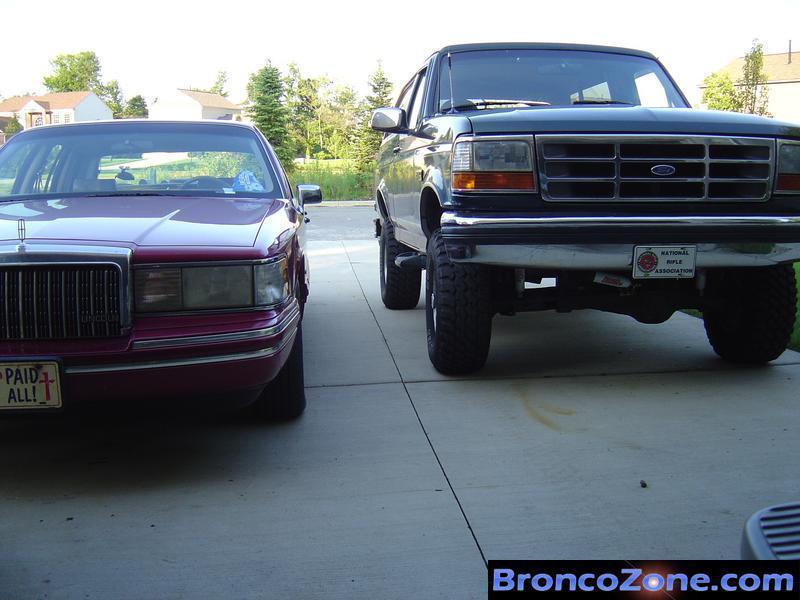 Bronco next to Father-in-Laws Towncar